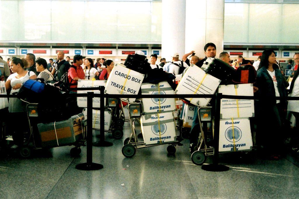 Some OFWs choose to bring their balikbayan boxes with them when flying back to home