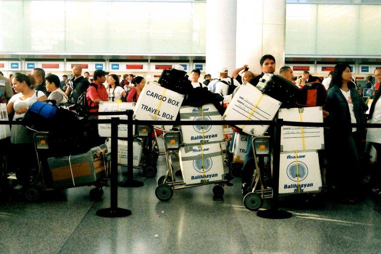 Some OFWs choose to bring their balikbayan boxes with them when flying back to home