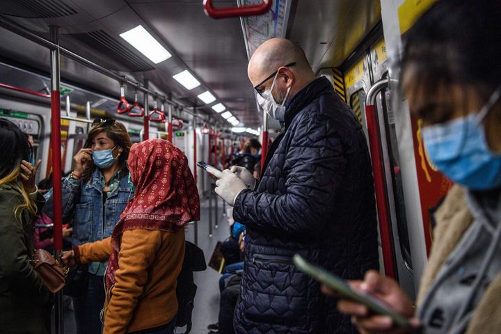 hong kong metro, people in masks, sick, illness, coronavirus